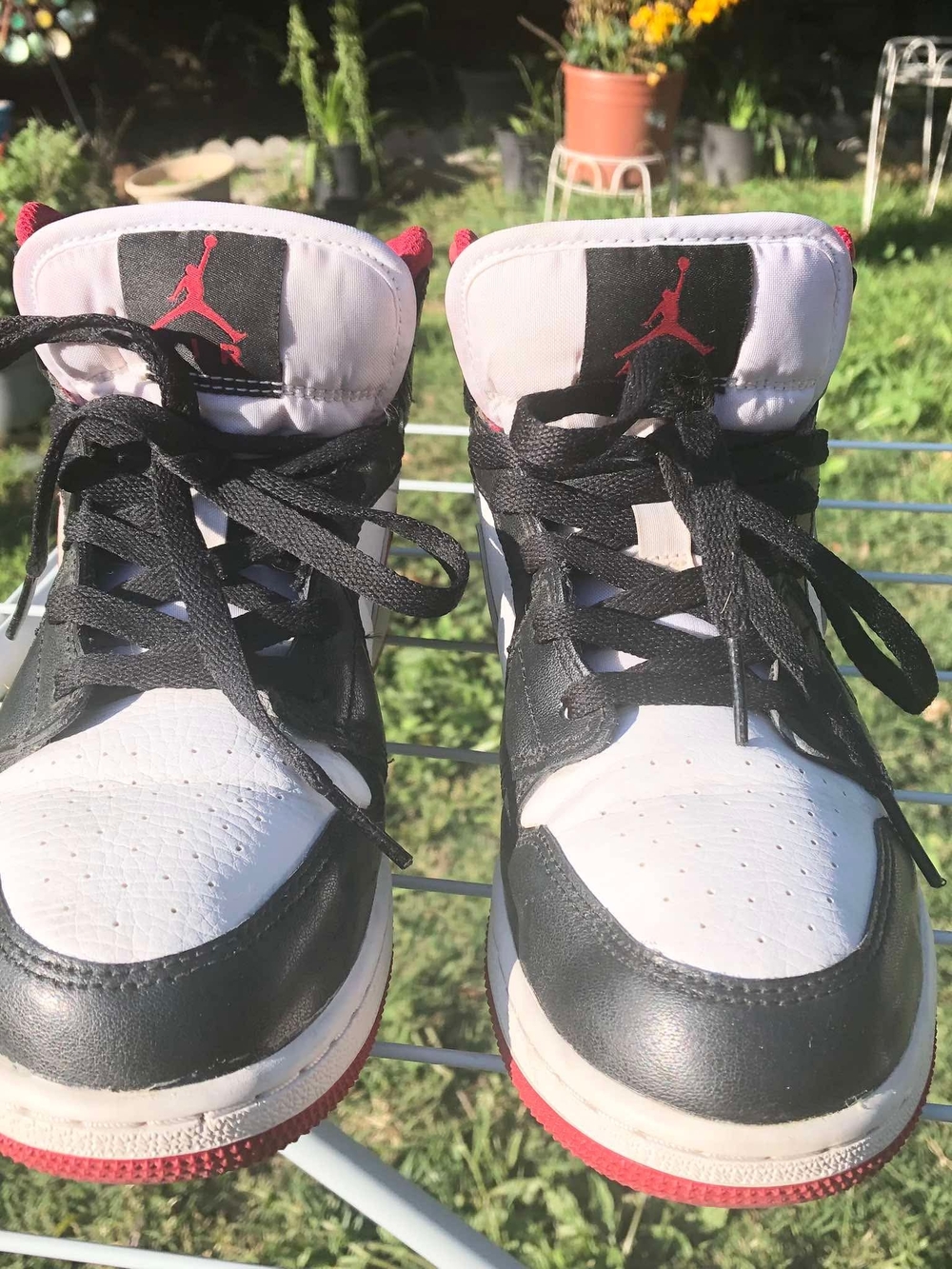 Nike Air Jordan 1 Mid sneakers in the "Gym Red" white and black colorway